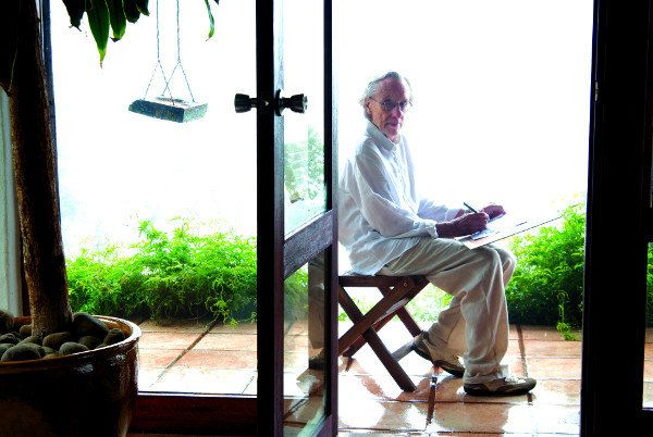 louis sketching on verandah